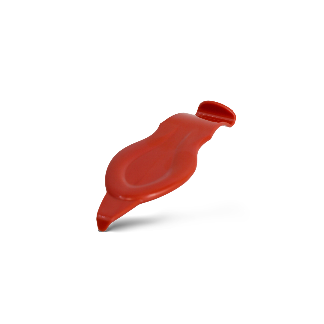 Red vinyl tucking tool for tight edges and trim.