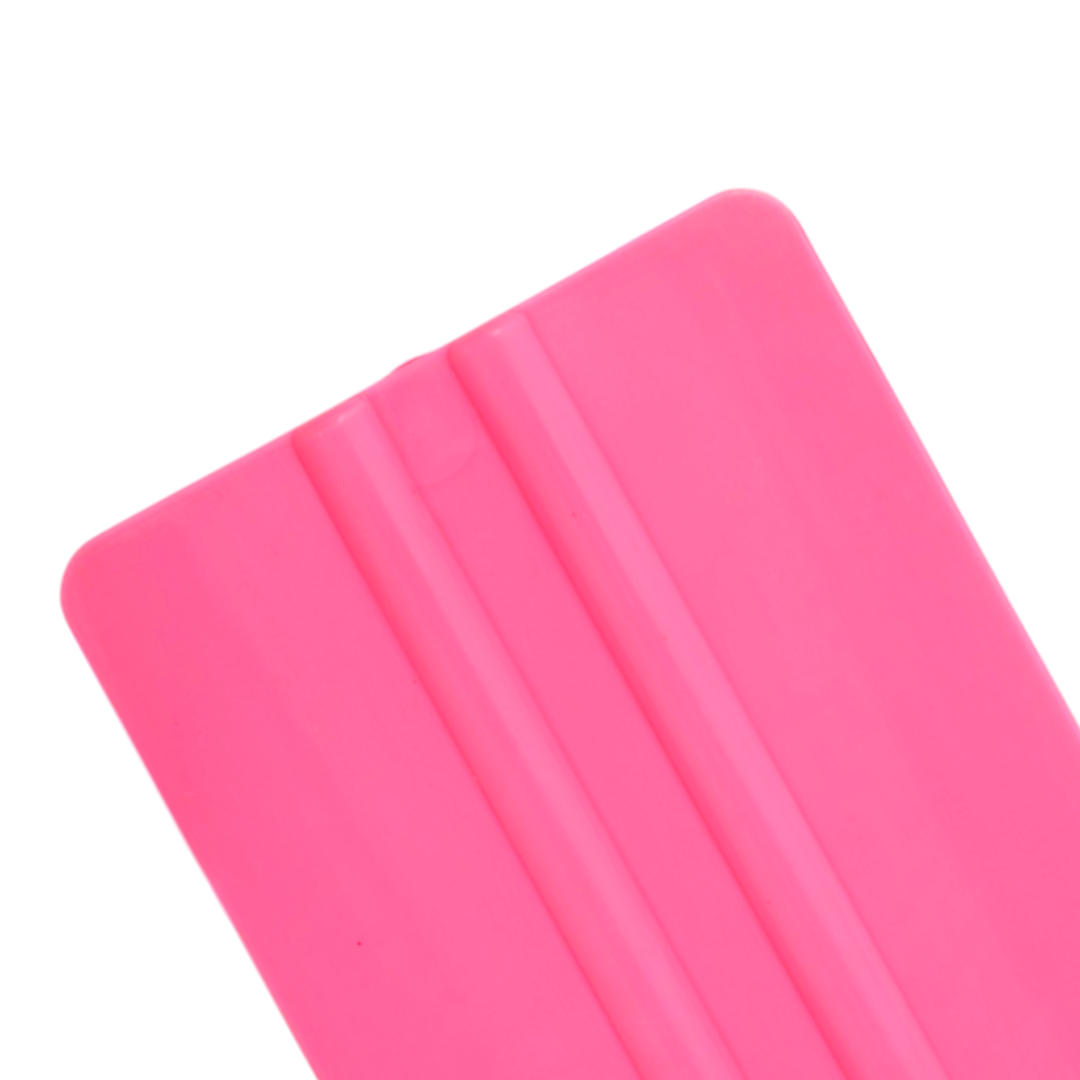 Wide pink soft flex squeegee for flexible wrapping applications.