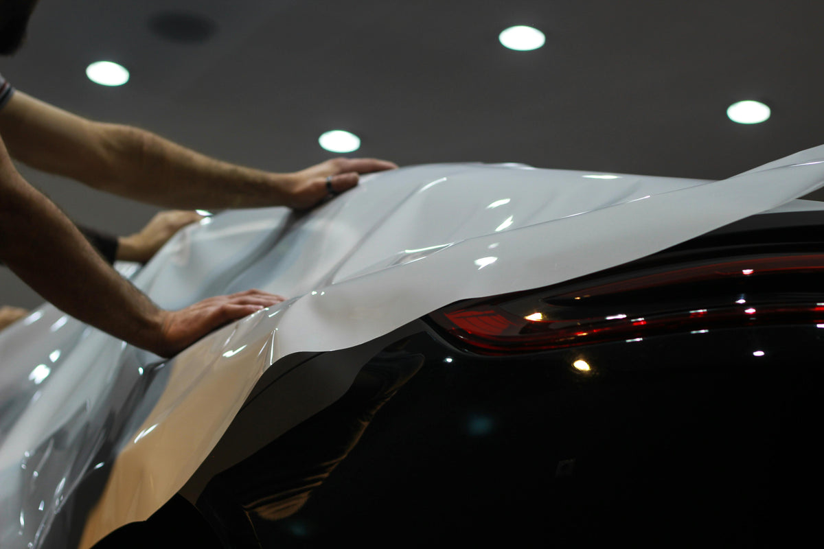 White vinyl wrap installed on a car