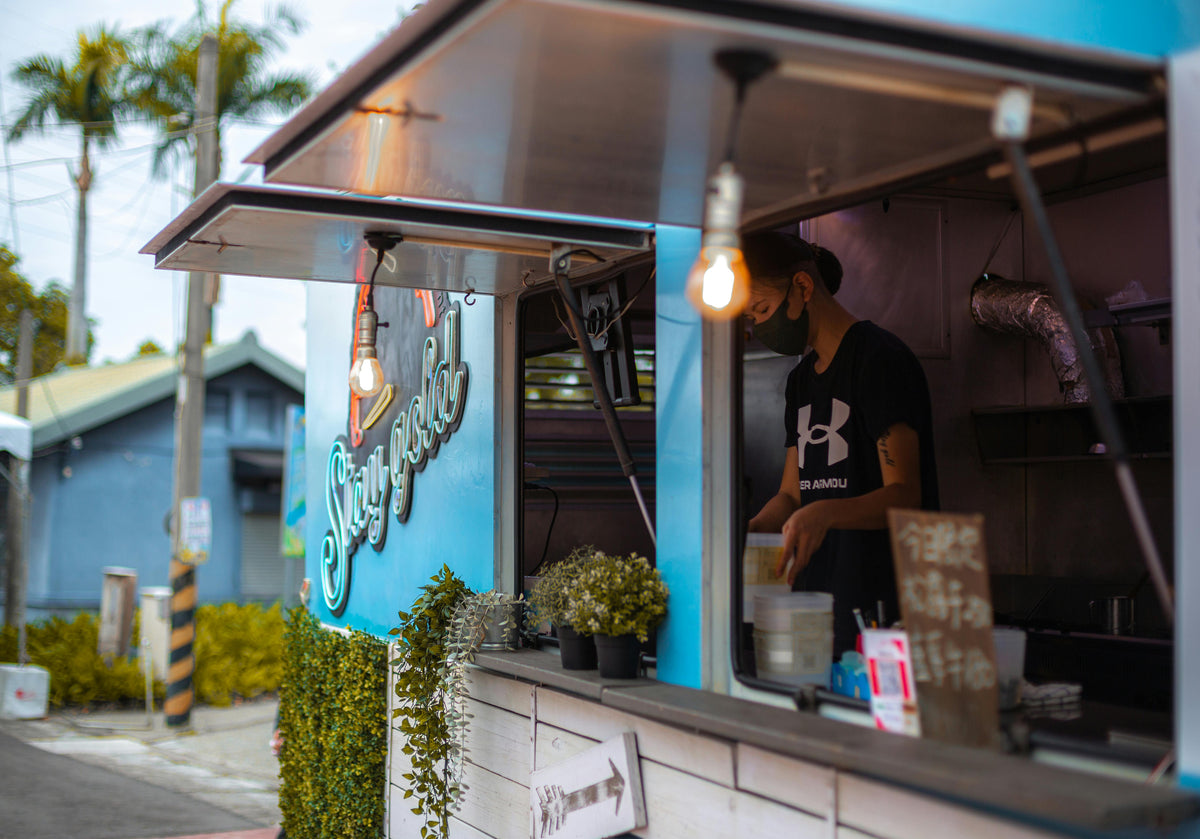 Food truck with car branding and signage