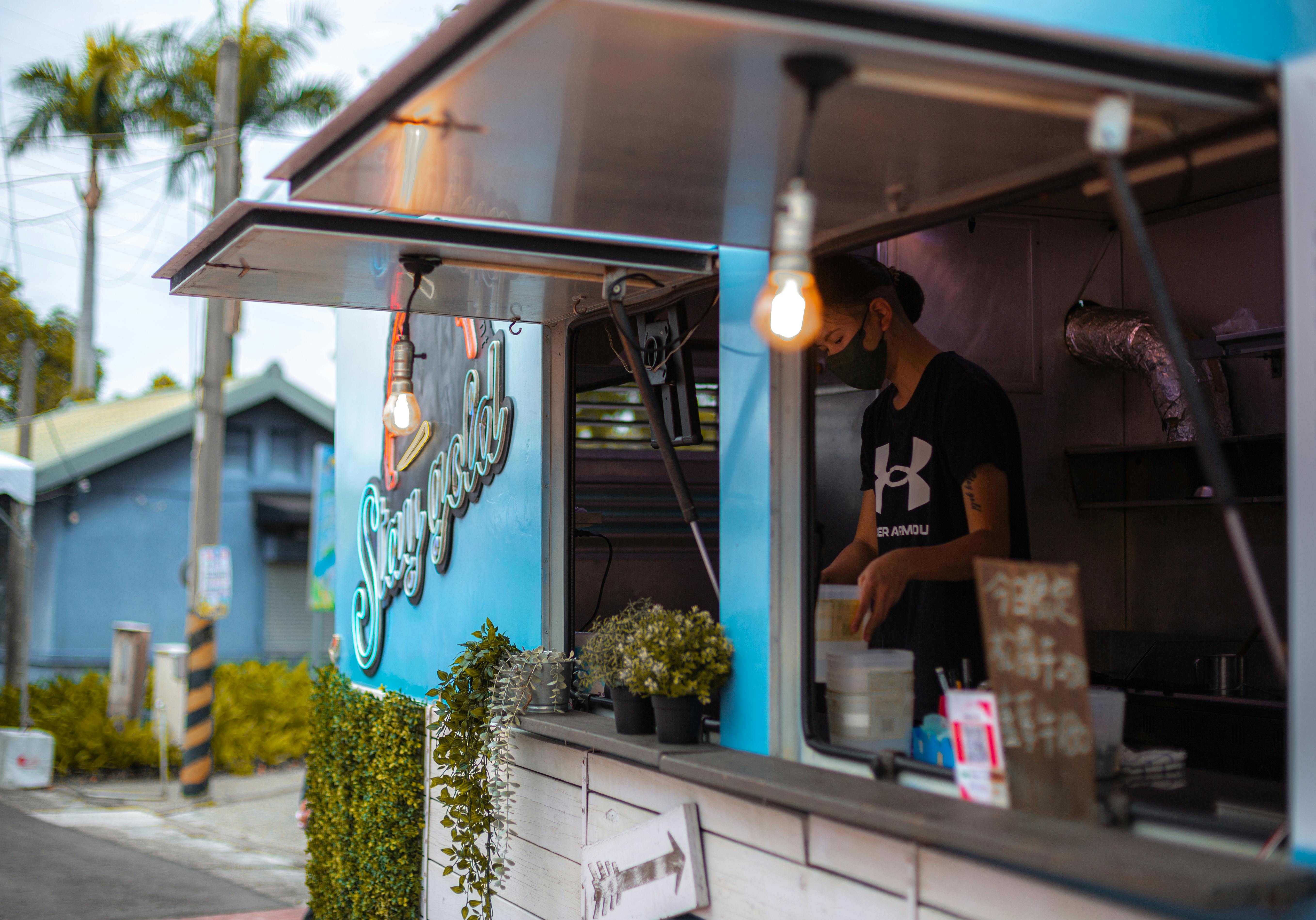 Food truck with car branding and signage