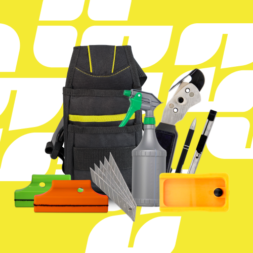 Black tool belt with various install tools on a yellow background
