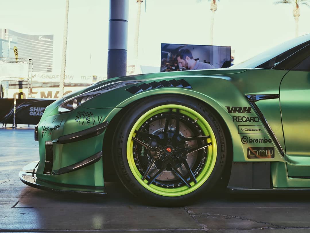 Performance car wrapped in bright green gloss vinyl