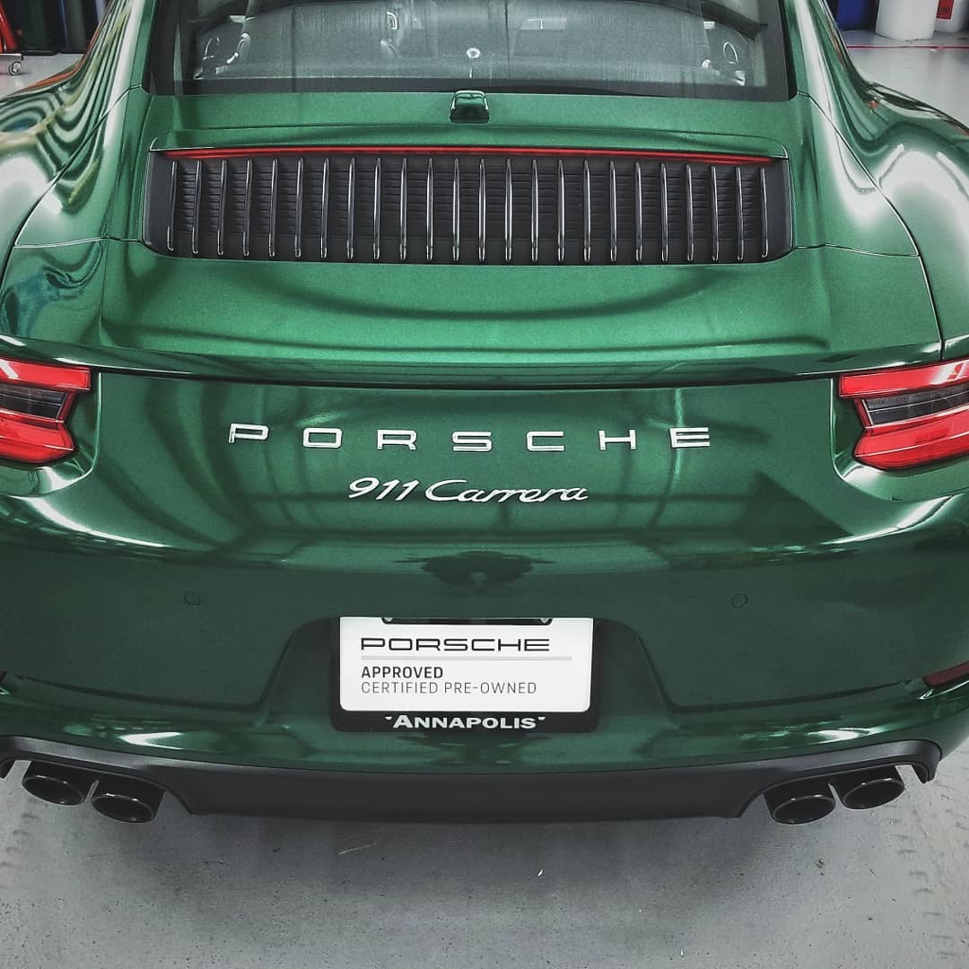Porsche with gloss metallic green vehicle wrap