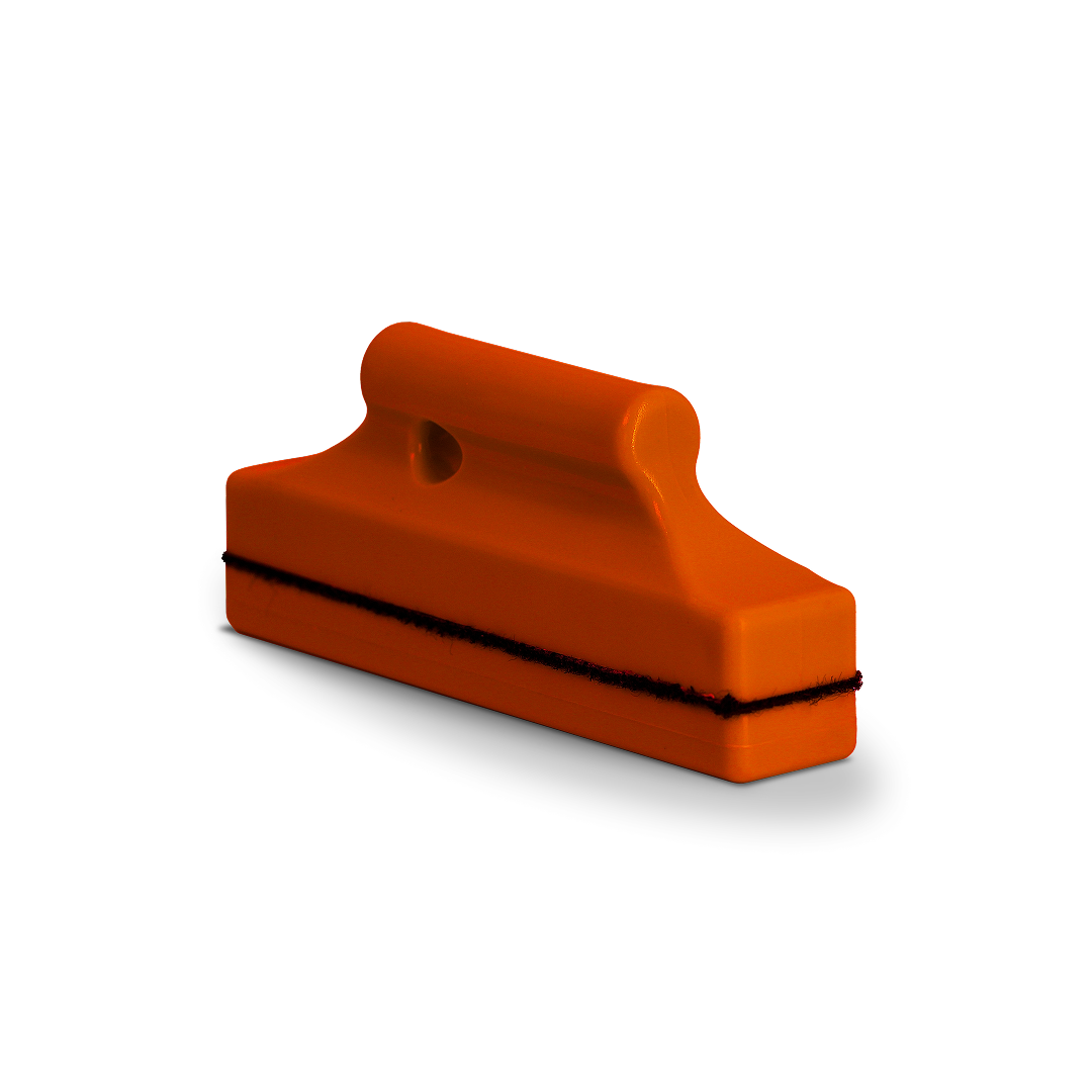 Stud-shaped magnet tool for vinyl and tint positioning.